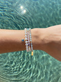 Nialaya Women's Beaded Bracelet Wristband with White Pearls and Blue Evil Eye Charm